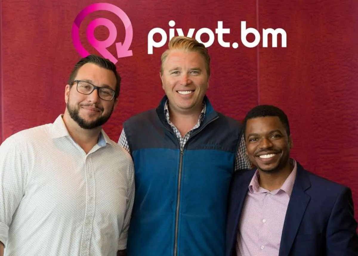 Three men in front of a wall carrying the pivot.bm logo.