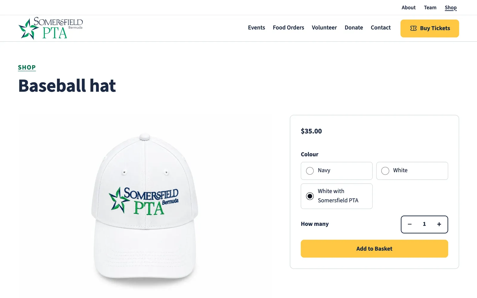 The baseball hat in the shop, with colour choices of navy, white, and white with Somersfield PTA